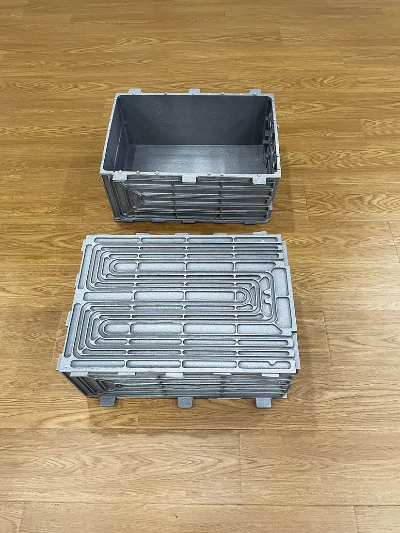 Battery enclosure with integral cooling path